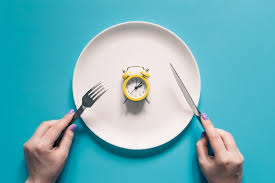 Clock on a plate indicating fasting